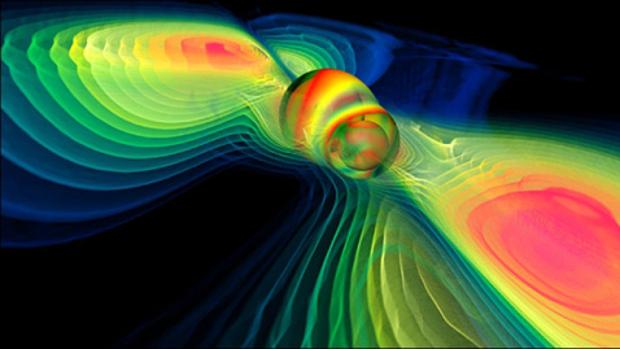 Simulación por ordenador de la fusión de dos agujeros negros y de ondas gravitacionales liberadas