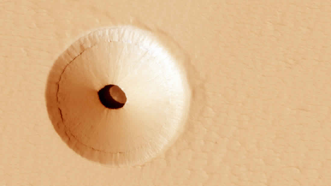 Develan un enorme y extraño agujero en Marte: entrada a una caverna subterránea